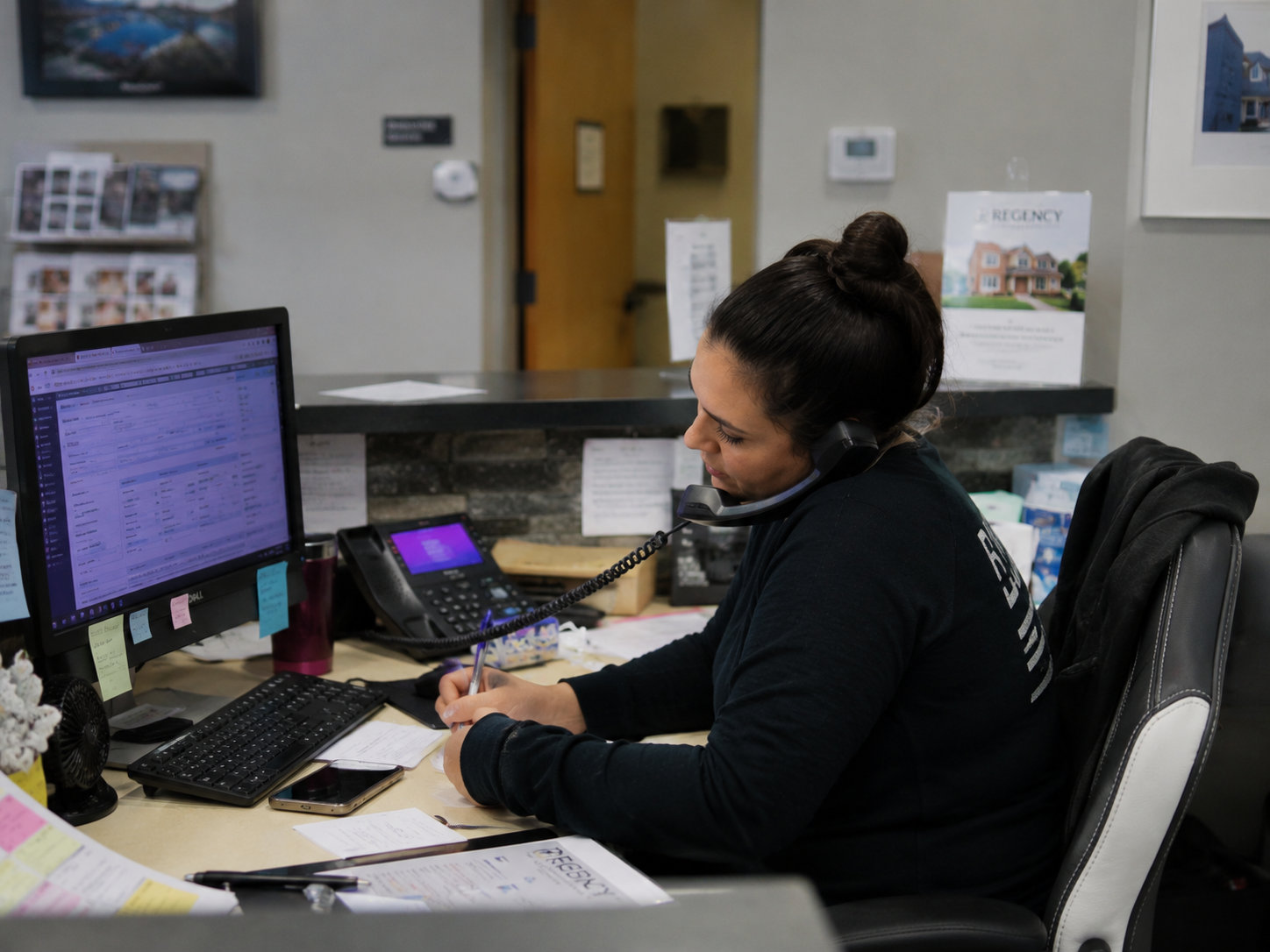 Front desk managing multiple calls and interruptions